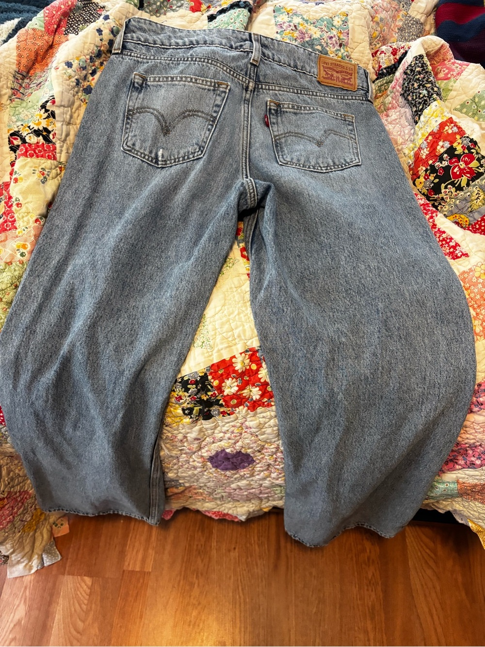 Levi's light blue denim jeans with tan leather patch